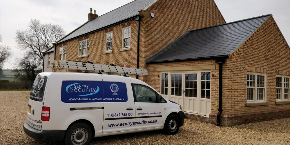Sentry Security van at a customer's premises